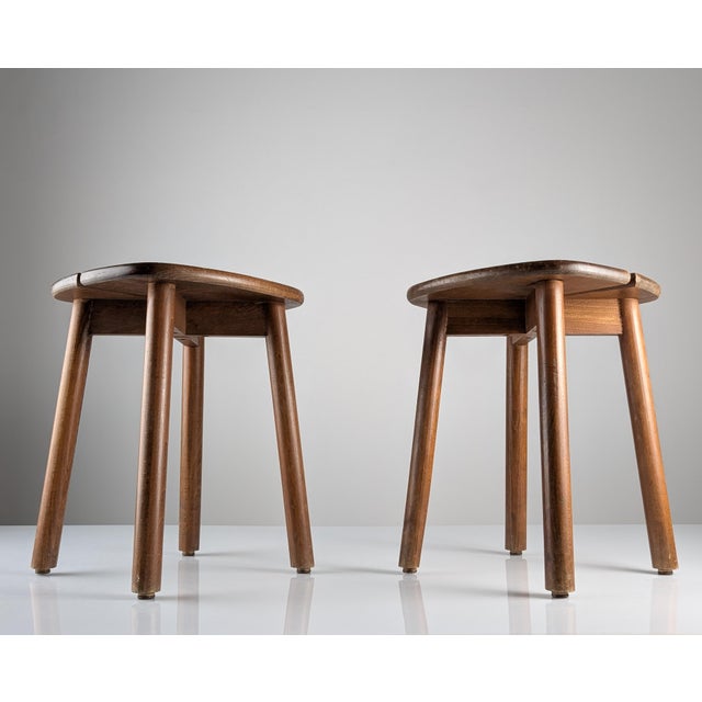 Pair of vintage solid wood stools designed by Pierre Gautier Delaye, manufactured in France during the 1960s. The design...