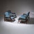 Mid-Century seating group consisting of a two-seater sofa and two armchairs. The armrests, seats and backrests are...