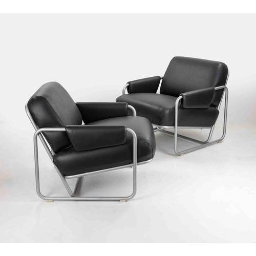 Set of two armchairs with structure made of a chromed tube and black skai by Guido Faleschini. Italy 1970s. Very good...