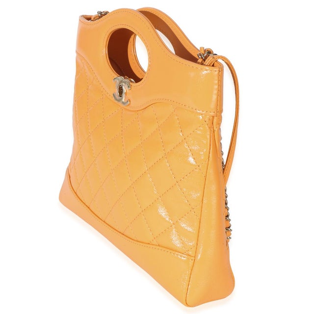 Item #: 153995 Interior Material: Fabric Size: 31 Features Interior: One zip pocket Dimensions: 9 x 7.5 x 1.75 in Handbag...