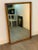 Midcentury walnut mirror by Strata for Unagusta, sleek modern mirror, with inset 31"x 49" clear mirror. Can be hung...