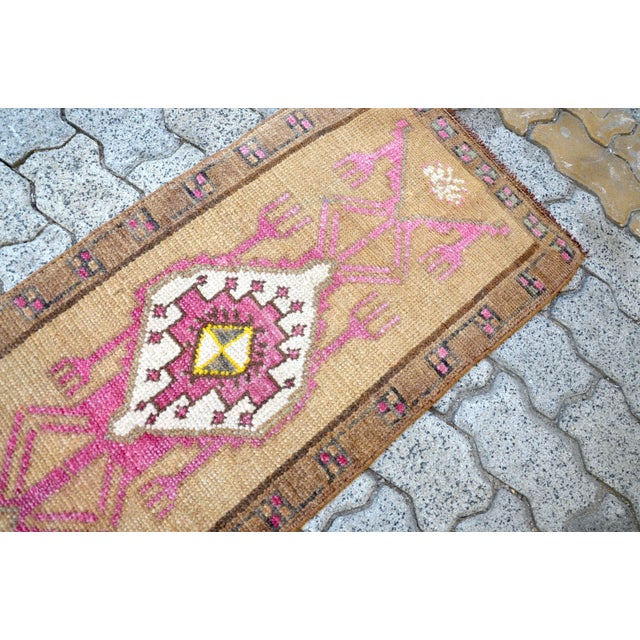 This is a vintage Turkish Oushak rug from the 1960s. The piece was hand-knotted.