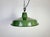 Industrial green enamel factory pendant light made in United Kingdom during the 1960s. White enamel inside the shade. Iron...