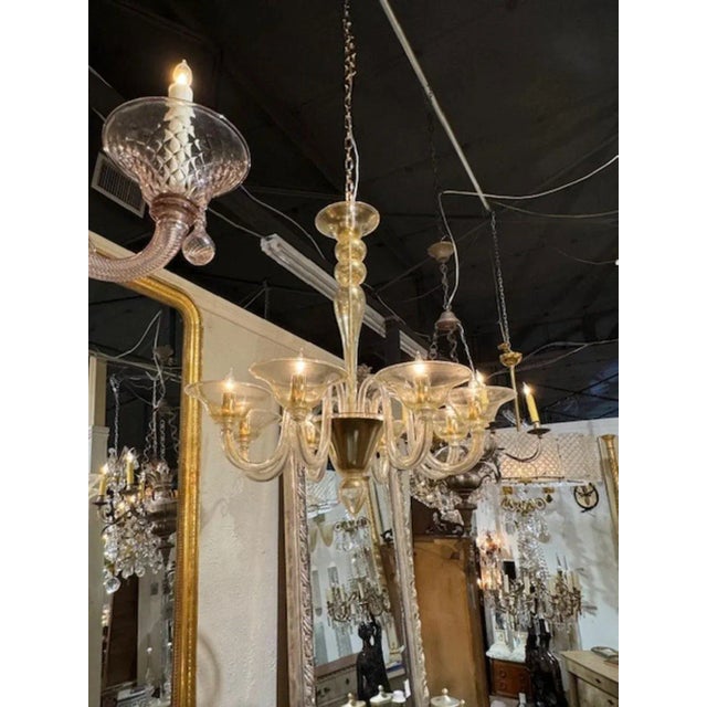 Modern Murano gold glass 8-light chandelier. Circa 2000. The chandelier has been professionally rewired, comes with...