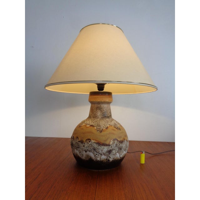 Lava ceramic lamp with original lampshade from the 1970s. European Plug (up to 250V).The wiring of this item may be...