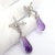 1980s Pair of Tiffany & Co Paloma Picasso X Drop Diamond Amethyst Night Day Platinum Earrings For Sale - Image 11 of 16