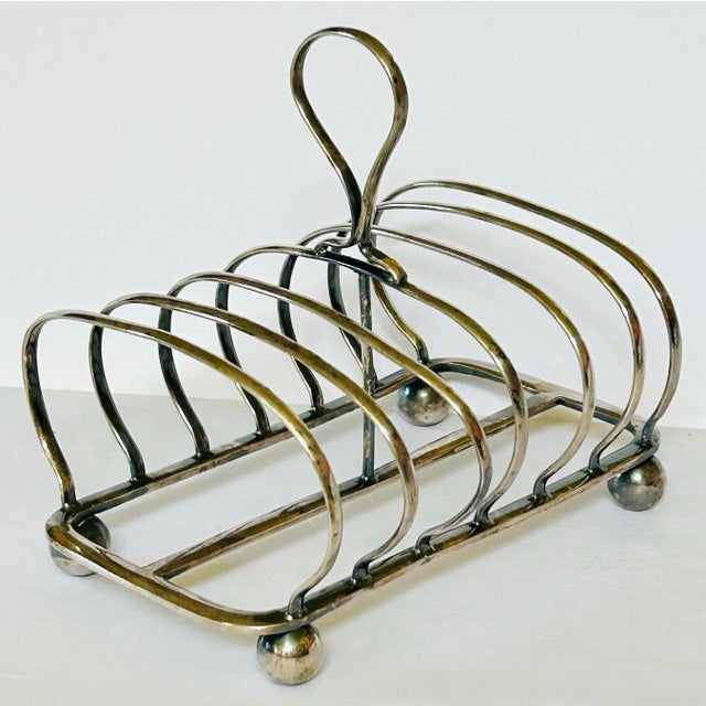 British silver plated toast server is great for it's original use but is also a welcome desk accessory to hold your mail...