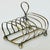 British silver plated toast server is great for it's original use but is also a welcome desk accessory to hold your mail...
