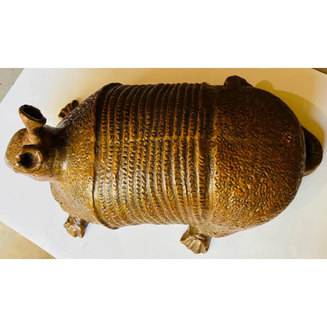 Handmade terra cotta armadillo. Quite a large and impressive size. The interior appears to be terra cotta.