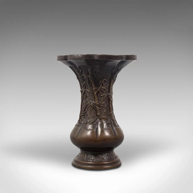 This is an antique Oriental vase. A Chinese, bronze decorative baluster urn, dating to the late Victorian period, circa...