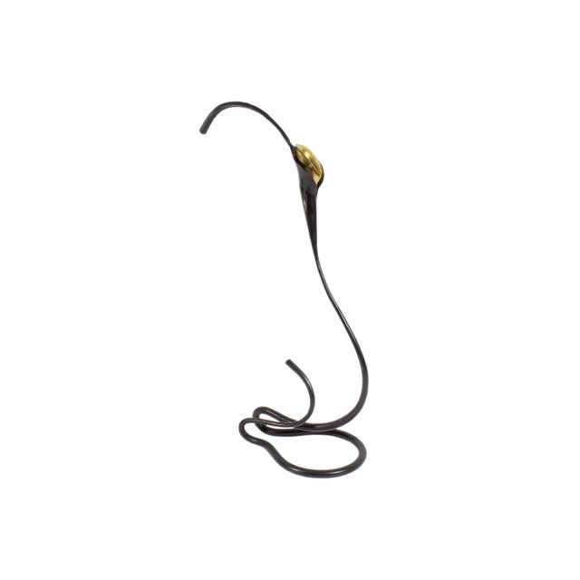 A hand-foraged iron and brass calla lily candle holder by the American artist and blacksmith Jack Brubaker. This piece...