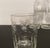 A set of seven 19th century cut glass tumblers, each decorated with star burst designs on the upper and arched panels on...