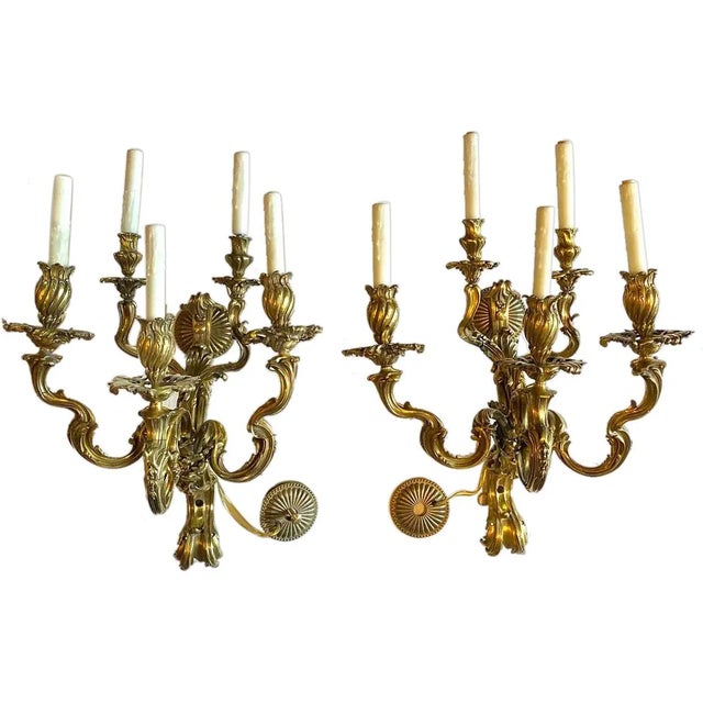 DETAILS A pair of antique, heavy, cast bronze wall lights. Possibly originally components of an architectural built-in...