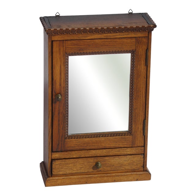 Antique Carved Wooden Wall Cabinet with Mirror and Ornaments For Sale