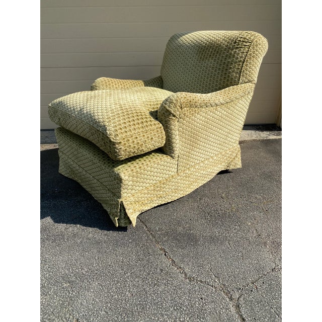 Howard & Sons Bridgewater chairs in beautiful sage green fabric with down cushions and tapered legs with brass casters.