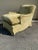 Howard & Sons Bridgewater chairs in beautiful sage green fabric with down cushions and tapered legs with brass casters.