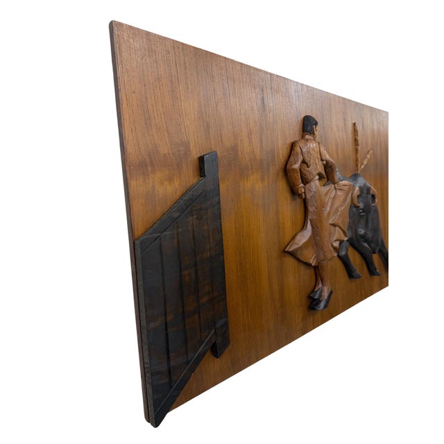 Make a bold statement with this striking Mid-Century Spanish Revival style carved wood wall hanging featuring a dramatic...
