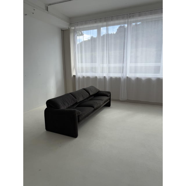 The sofa is in excellent condition. The original Cassina manufacturer’s label is located underneath the seat. This piece...