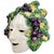 An exquisite vintage Italian glazed terracotta wall mask depicting Bacchus, beautifully hand-painted with vibrant purple...