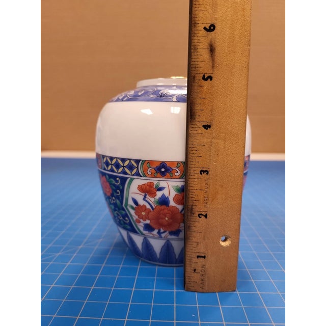 Elegant Tiffany & Co. porcelain vase featuring a delicate floral design and fine craftsmanship. Made in Japan, this...