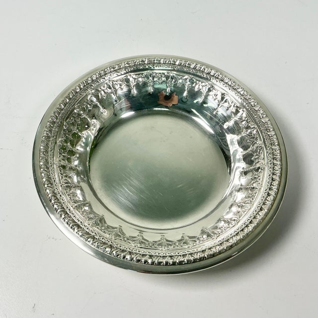 A pretty Baroque style Reed & Barton Silverplated Wine Coaster will add a touch of Hollywood Regency to your next event....