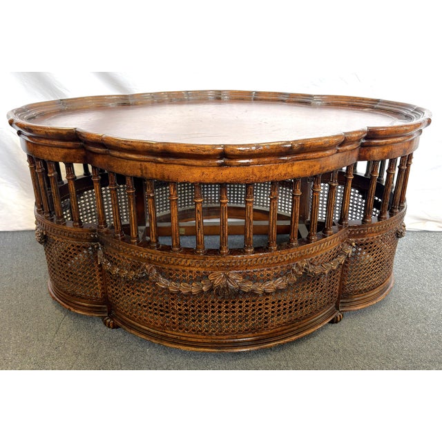 Love this vintage John-Richard coffee table from the late 20th century. It has a French look with a scalloped top edge...