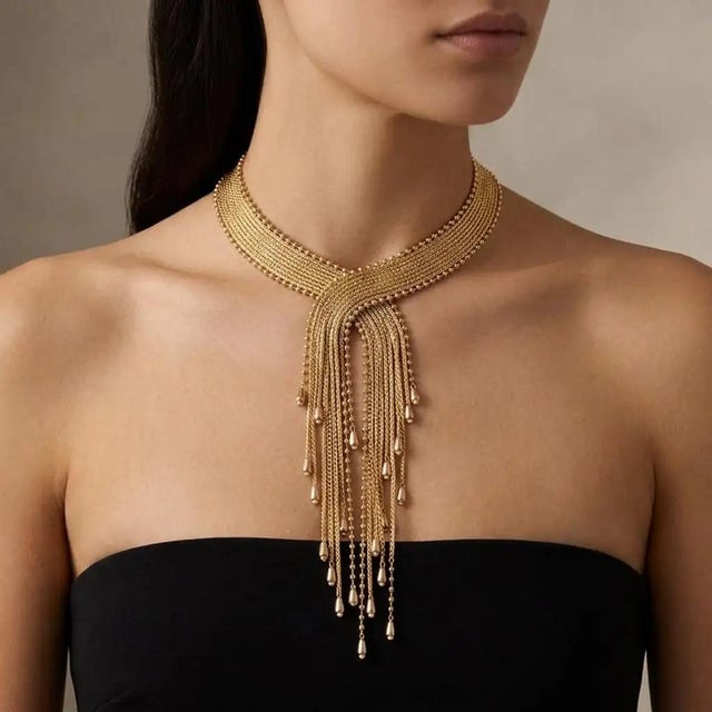This striking vintage costume necklace from the early 2000s is a masterclass in high-glamour maximalism, blending a...