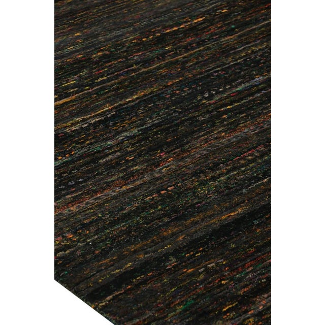 Made with hand-knotted silk, this 12x15 rug is a particularly bold and rich new addition to Rug & Kilim’s Modern and...
