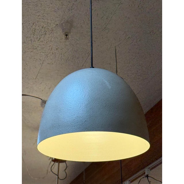 Design Plus Gallery presents a Dome Pendant from Tuxedo Park Lighting. While it has a "rough stone" or "concrete type"...