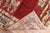 A finely woven Turkish rug executed with pristine jewel-tone colors. A cherry red open field spacious motif. The floral...