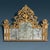 Richly carved gilded chimneypiece, support frame and double-framed protruding side posts with mirrors surmounted by carved...