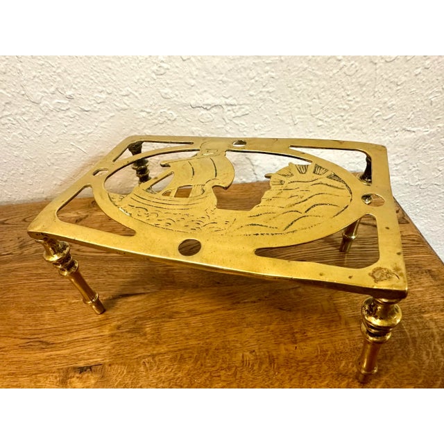 A very good brass trivet with ship motif. Rectangular design. Very nice detail. Hand sourced in and imported from England.
