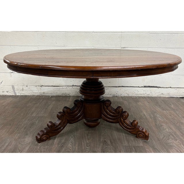 This is a stunning antique French Renaissance Revival or Victorian Renaissance solid oak round dining table dating to the...