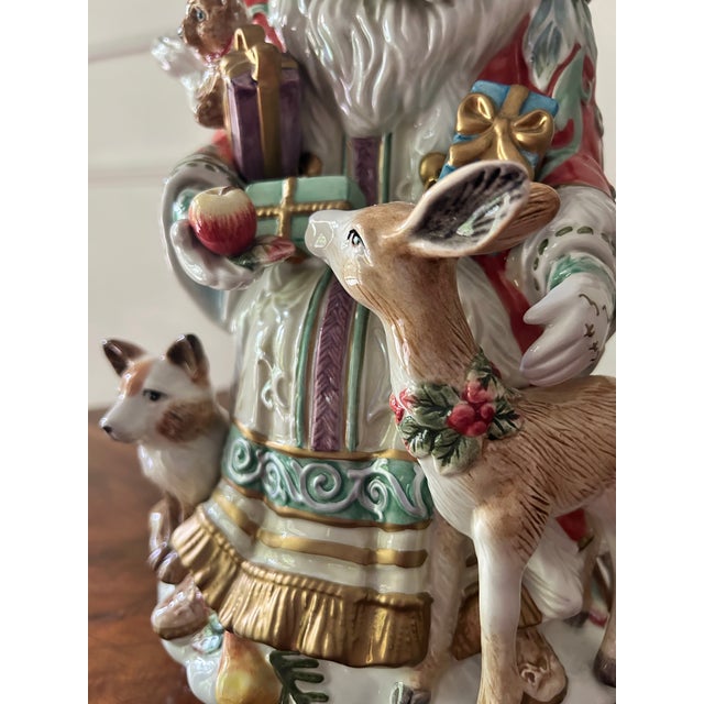 The Fitz and Floyd ENCHANTED HOLIDAY Teapot is a beautifully decorated ceramic/porcelain tea pot featuring Santa Claus and...