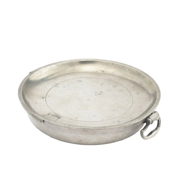 Pewter warming plate with drop bail handles, impressed with the mark of Edward Wilkes & William Villers. Impressed on the...