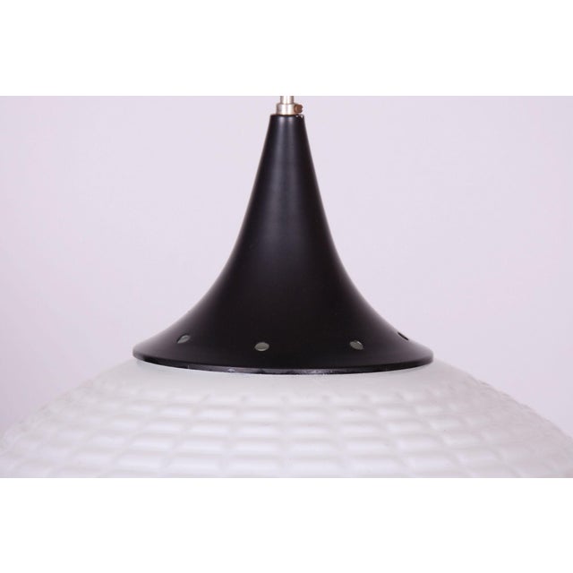 This stylish and highly elegant chandelier, originating from the 1960s from Czechoslovak production, represents an...