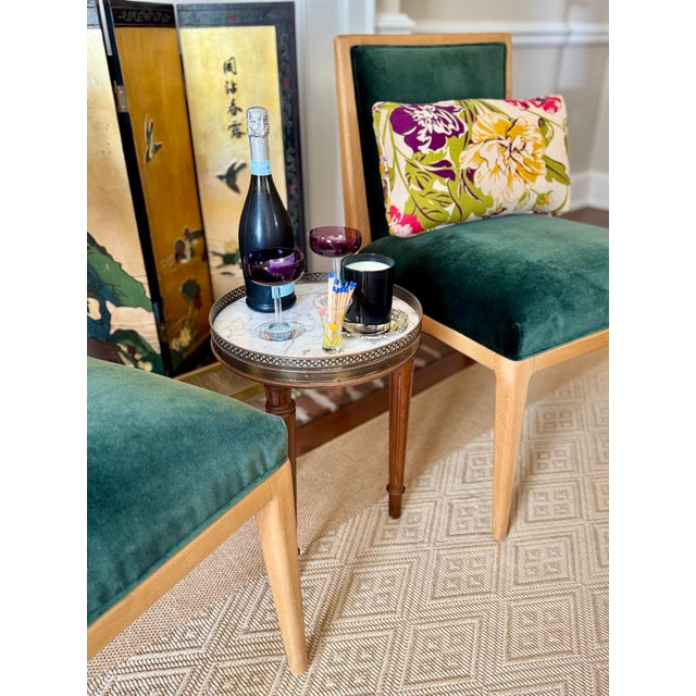 This is a lovely three legged round French Bouillotte style table. The craftmanship is wonderful! It has a marble top with...