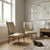 A pair of vintage bedroom armchairs with beech wood legs, sprung padding, and original period fabric upholstery. This...
