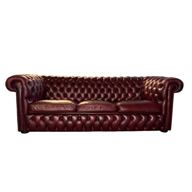 Genuine leather with deep button tufting Traditional Chesterfield with rolled arms and studded detailing Beautiful vintage...