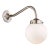 Wall light in brass, with one part ‘curved’ arm, closed gallery 3 1/4” and opal spherical glass. For indoor use only...