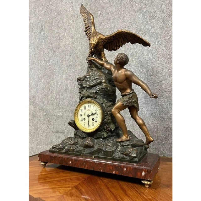 Large napoleon iii period clock in spelter with a double patina of brown and gold. depicting a spectacular eagle hunter...