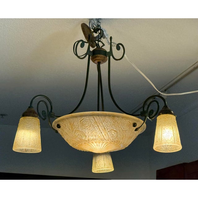 Design Plus Gallery presents a Vintage Chandelier. The opaque patterned glass is supported by softly swirling bronze...