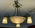 Design Plus Gallery presents a Vintage Chandelier. The opaque patterned glass is supported by softly swirling bronze...