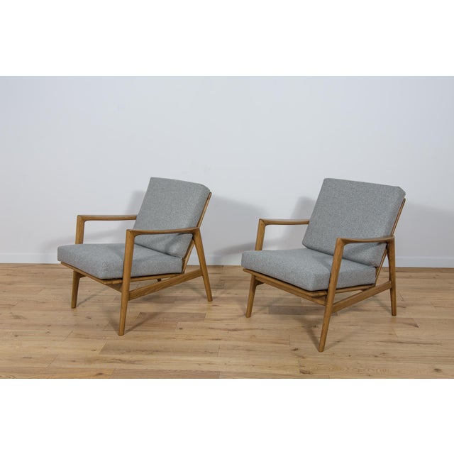 This pair of armchairs was produced by the Polish company Swarzędzka Furniture Factory in 60s.The armchairs have new...