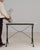 This piece carries genuine presence, its white/gray marble top, black iron Y-form base immediately setting the tone for...