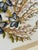 Old Florida kitschy at its finest. A charming 1975 handcrafted seashell floral arrangement featuring mussel shell flowers,...