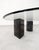 Italian coffee table with a clear glass top and geometric solid marble shapes in the style of the designs of Massimo...