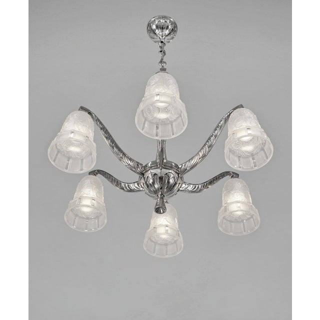 Hettier & Vincent A stunning 1925-1935 French art deco chandelier by Hettier & Vincent in nickel plated bronze. The...