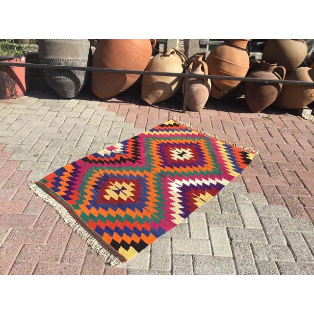 This beautiful, vintage, handwoven Kilim is approximately 60 years old. It is handmade of very fine quality, hand-spun...