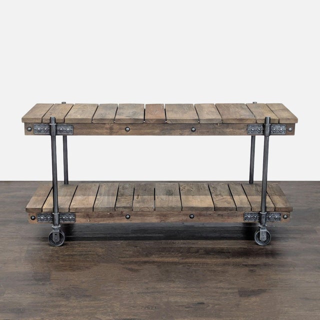 Industrial style reclaimed wood console with iron fittings. Brand: Pottery Barn. Original Price: $1609. Dimensions (in):...